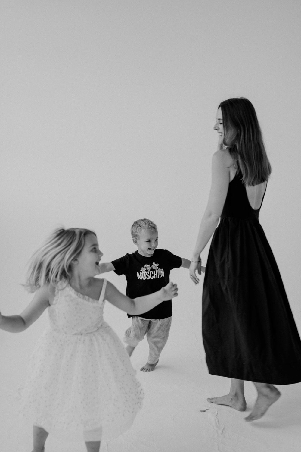 Family posing together during a Mothers Day Minis studio session